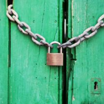 Brass-colored Metal Padlock With Chain